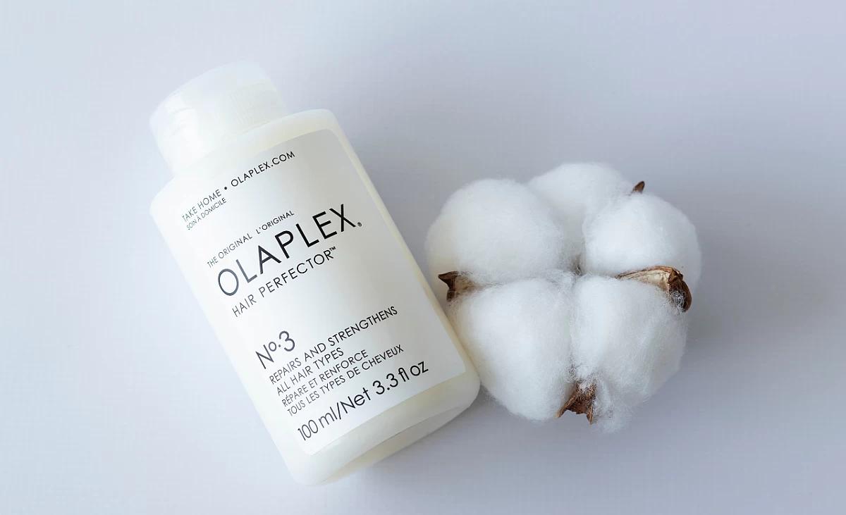 Photo of Olaplex Hair Perfector No. 3 and cotton flower for decoration