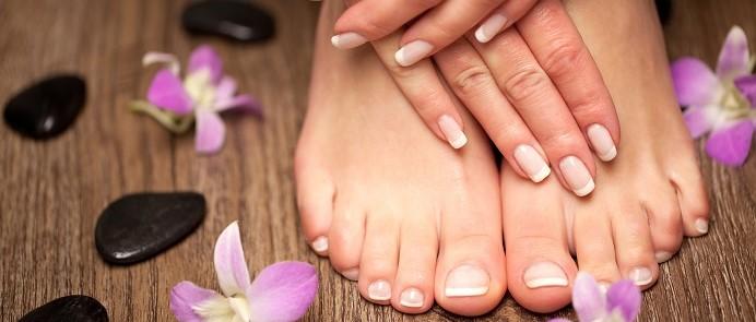 Hands and feet with French manicure